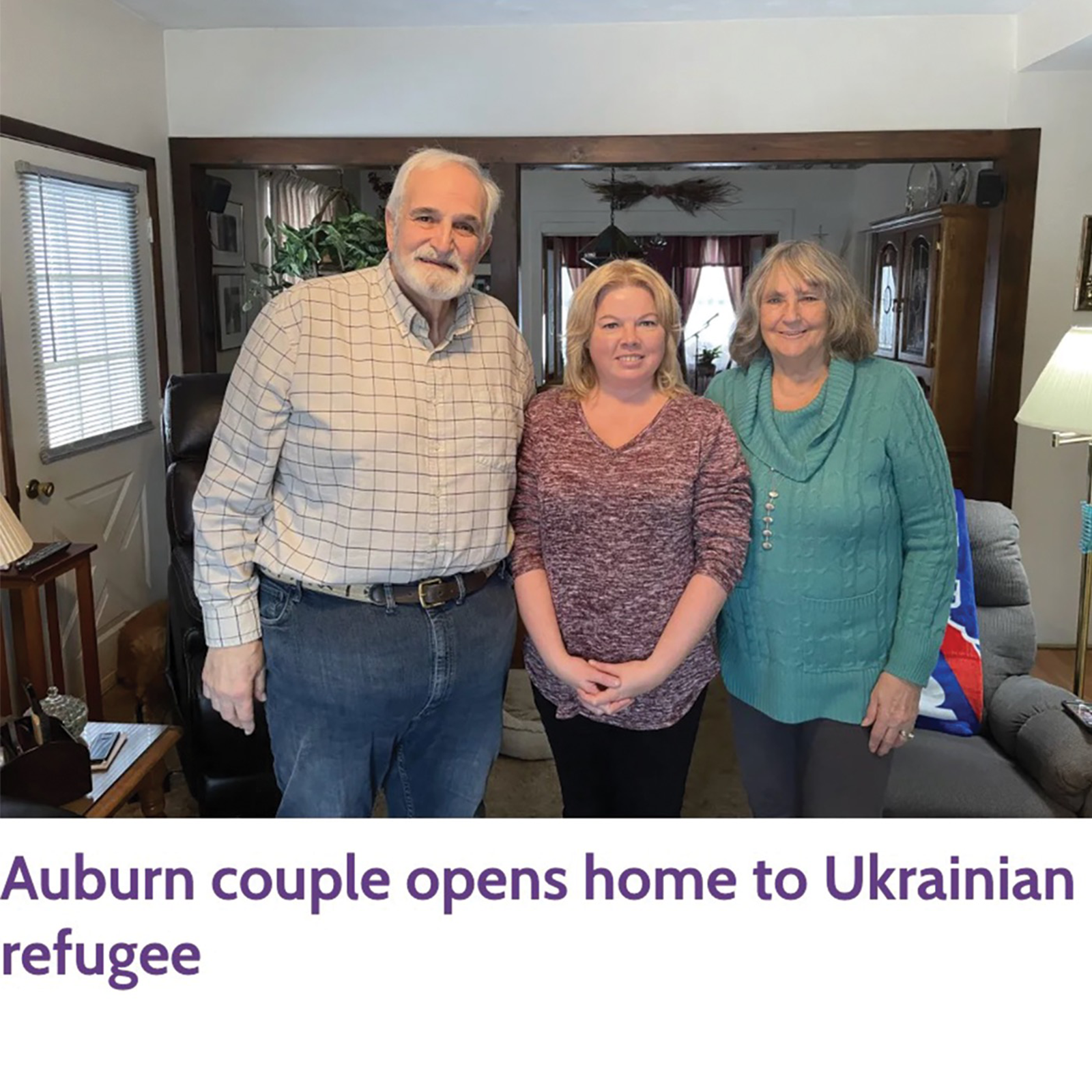 local Auburn couple posing with Ukrainian refugee they are hosting