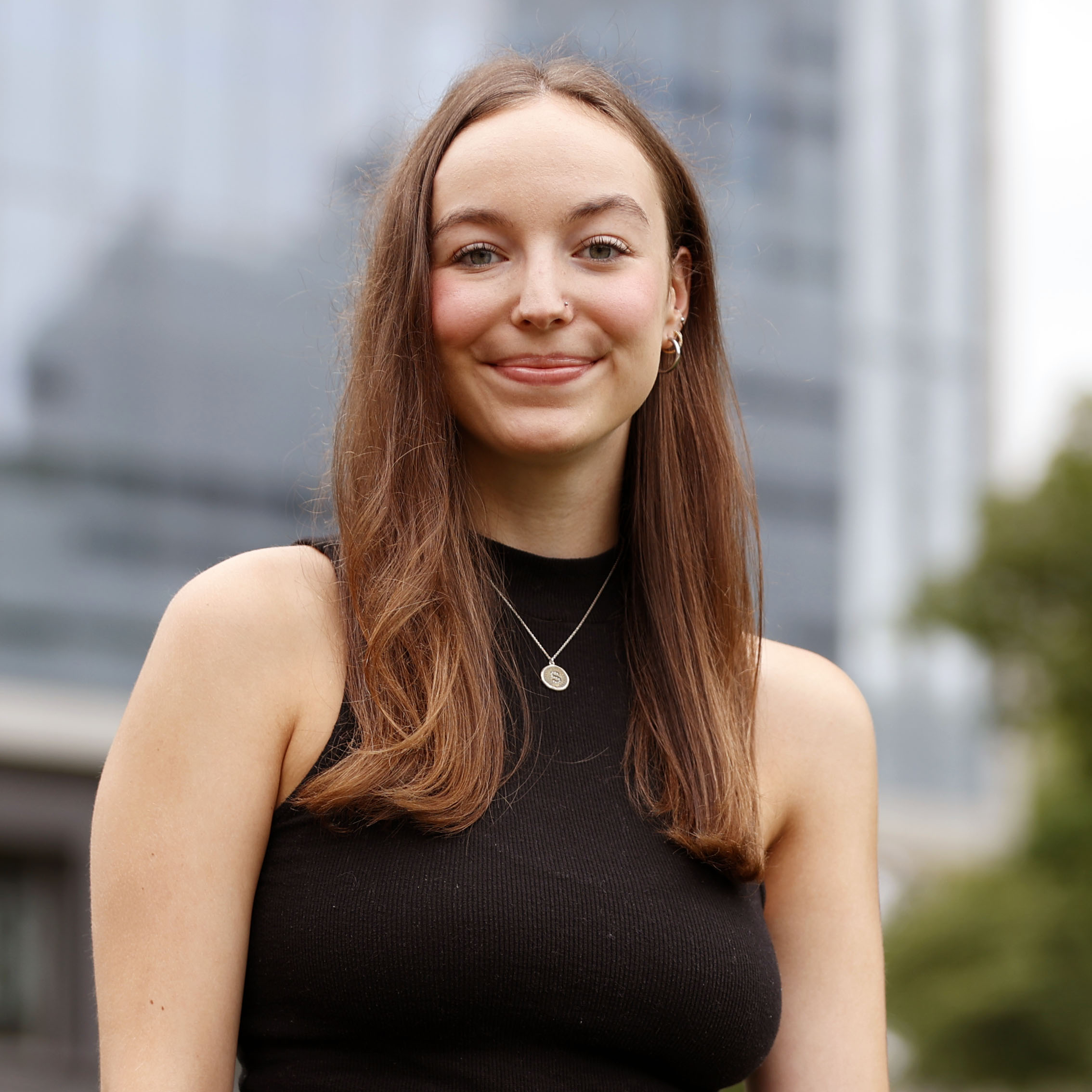 portrait of Sarah Dolgin in front of Newhouse School