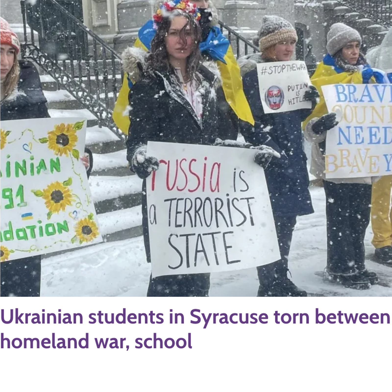 SU student holding sign to protest war against Ukraine