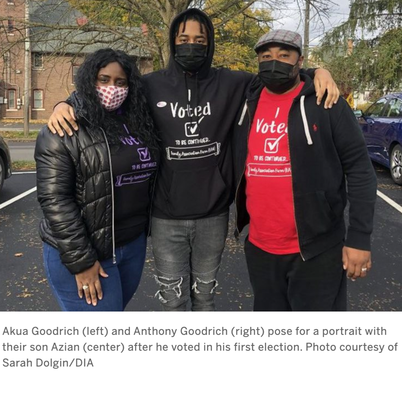 the Goodrich family posing outside of their local polling station